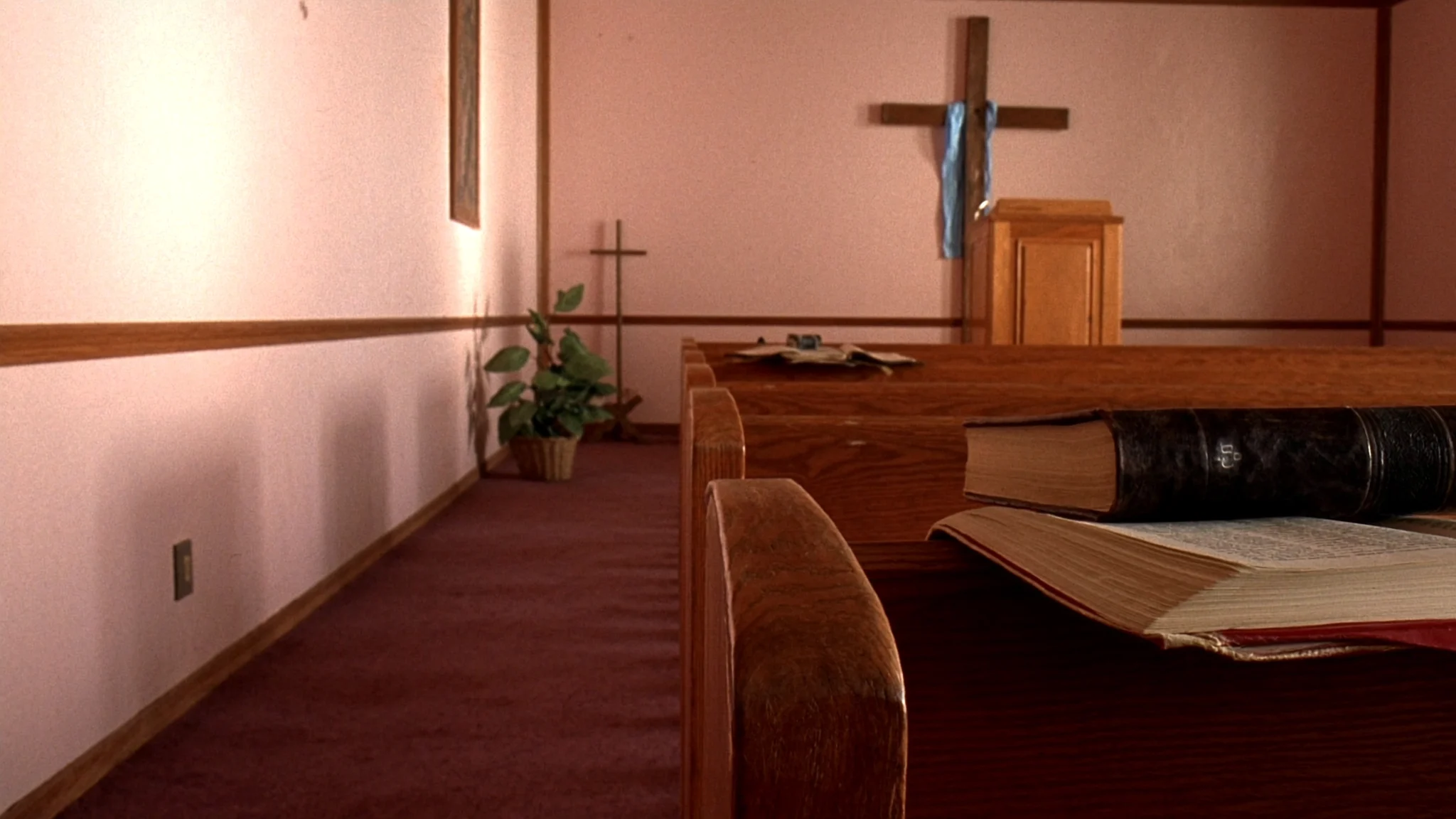 Wooden pews in the Mt. Carmel sanctuary in morning light